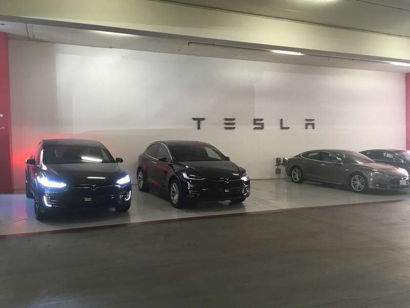 Tesla X's at charging station at Mall, El Paseo Village, Palm Desert, California.