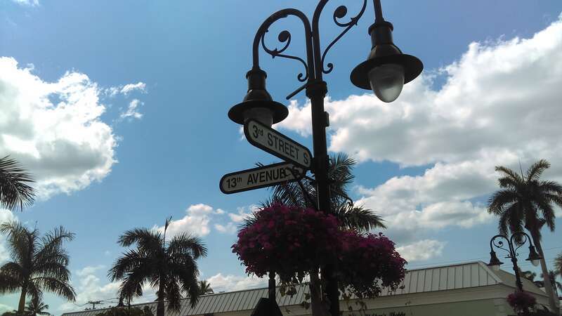 Street signs at popular spot in Naples, FL.