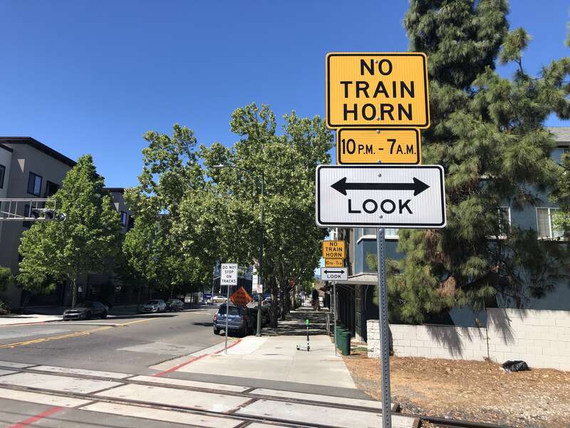 Signs along East Taylor Street in San Jose, California, United States, warn that the Union Pacific Warm Springs Subdivision is part of a partial quiet zone. As of April 2022, trains are no longer required to sound their horns at every crossing along