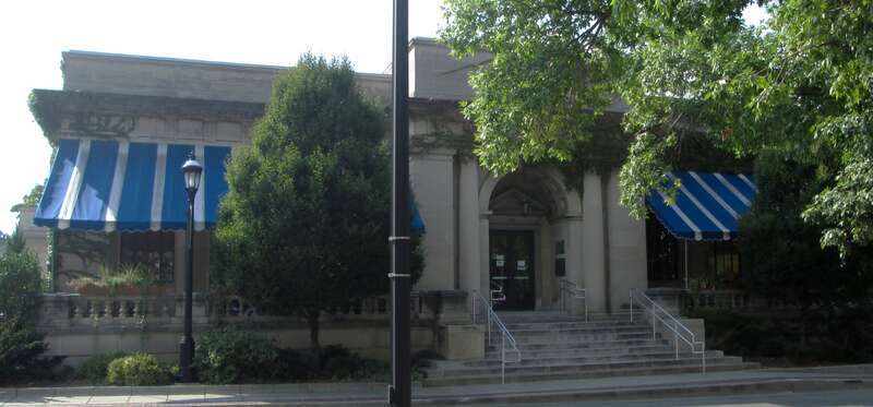 The Urbana Free Library, located at 210 West Green Street in Urbana, Illinois, was founded in 1874.  The library's current building was designed by Joseph Royer in the Classical Revival style and opened in 1918; it was expanded in 1974-75 and