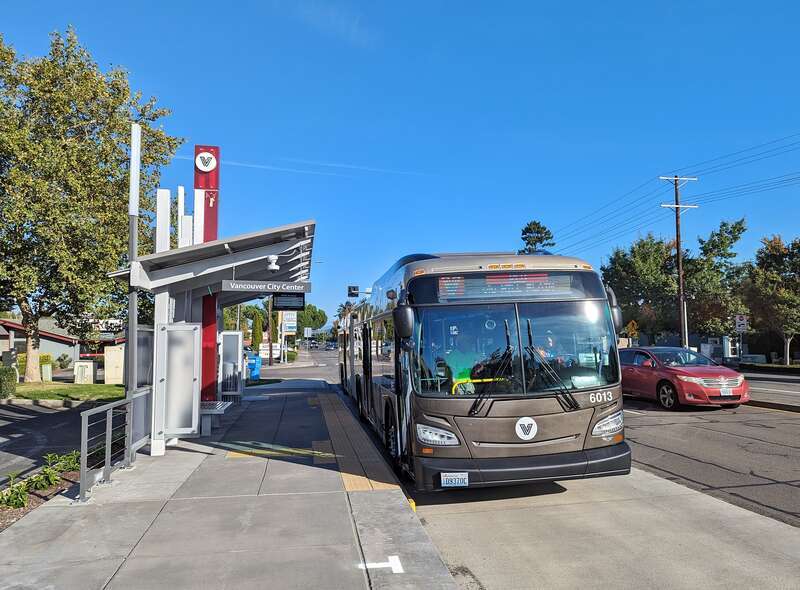 A C-Tran articulated bus on the Red Line of The Vine bus rapid transit system in Vancouver, Washington, United States. This westbound bus is pulling into the 157th Avenue Station on Mill Plain Boulevard.