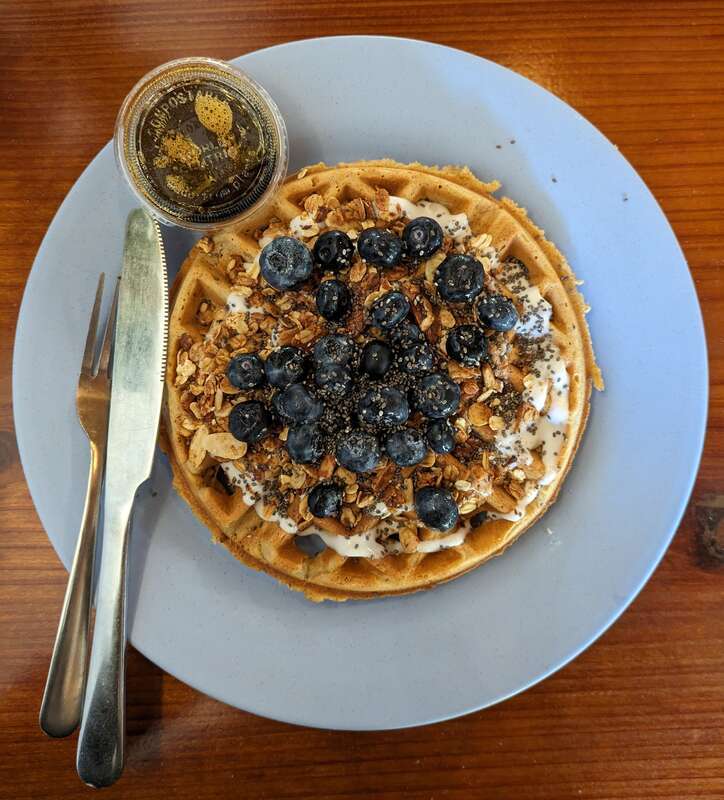 A lemon and blueberry waffle served at Rooted Coffee Co. in Walnut Creek, California, United States. Vegan and gluten free.