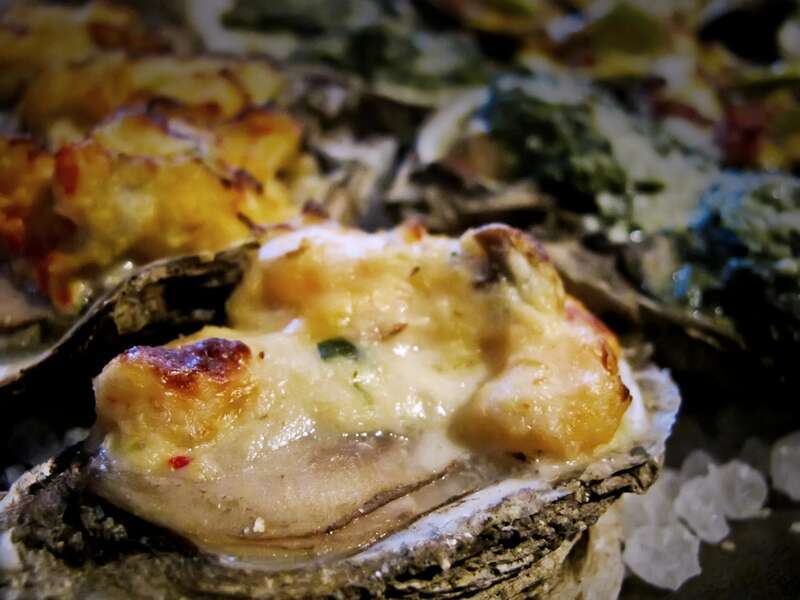 ..gobbling the oyster sampler, 16 pieces of yummy oysters..