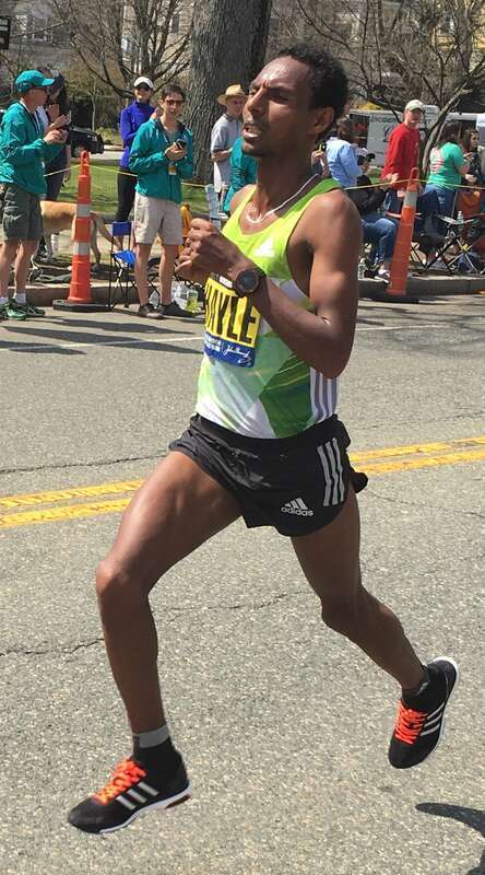 w:Lelisa Desisa leads w:Lemi Berhanu Hayle as they are the first men to pass mile 19 in Newton, Massachusetts during the w:2016 Boston Marathon. Hayle went on to win the elite men's division; Desisa came in second.