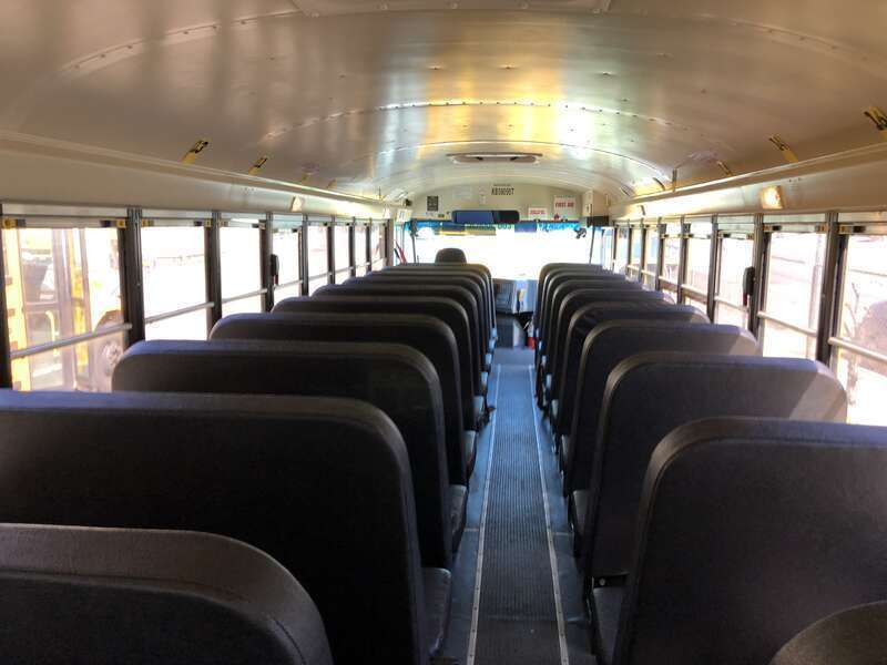 Front-facing interior view from the rear of a First Student school bus at a bus depot in East Orange, Essex County, New Jersey