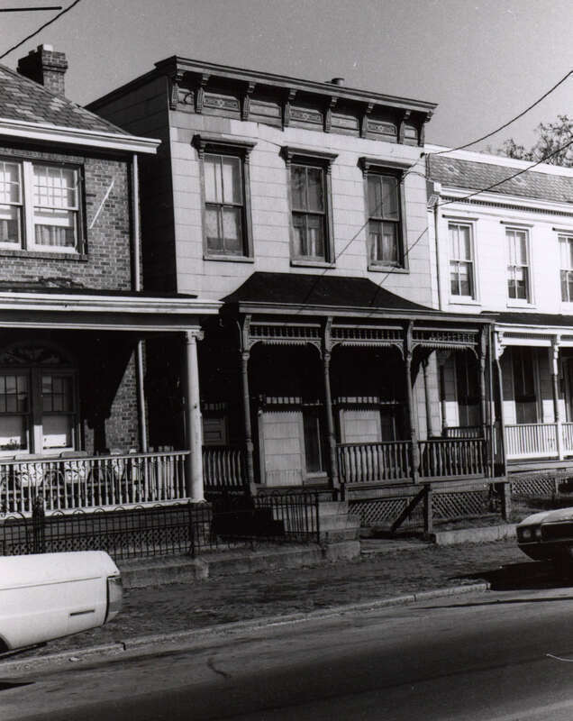 Address/Title: 210 West Leigh Street
Photographer: Zehmer, John G. (John Granderson), 1942-
Original Description (from Book): This wooden house has an elaborate porch in the Eastlake style. All of its wooden trim is intact and the only major