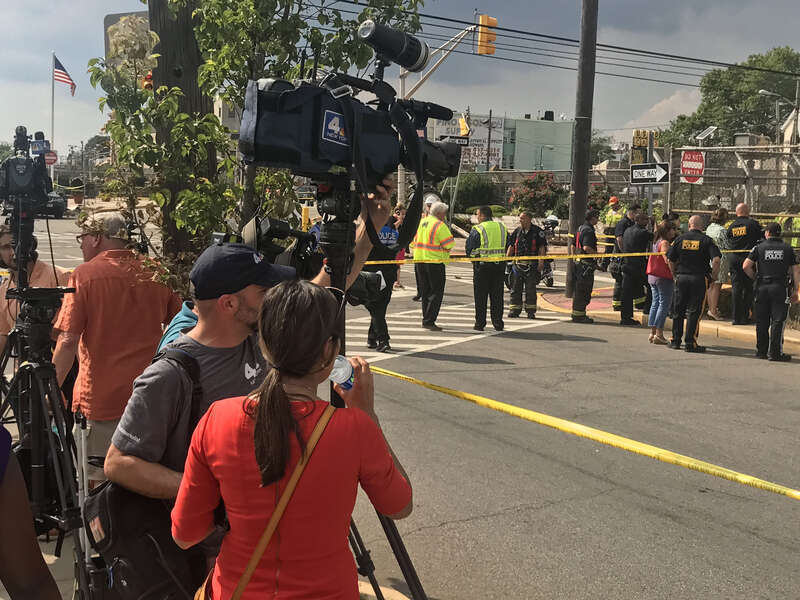 Scene of a July 3, 2019 vehicular accident at 30th Street and Palisade Avenue in Union City, New Jersey, where just before 1pm EST, an orange Union City Department of Public Works garbage truck careened across two sidewalks, knocking down a utility