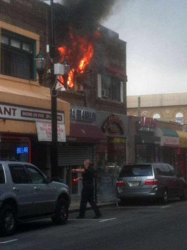 A fire at 4114 Bergenline Avenue in Union City, New Jersey on August 15, 2012. The fire started a short time before 12:45pm, when police officers first arrived on the scene, which was when I was passing by in a commuter van, and first saw what was