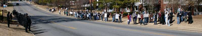 Protesters and Police in Atlanta, Georgia during the 2008 Anonymous protest against The Church of Scientology on February 10, 2008
