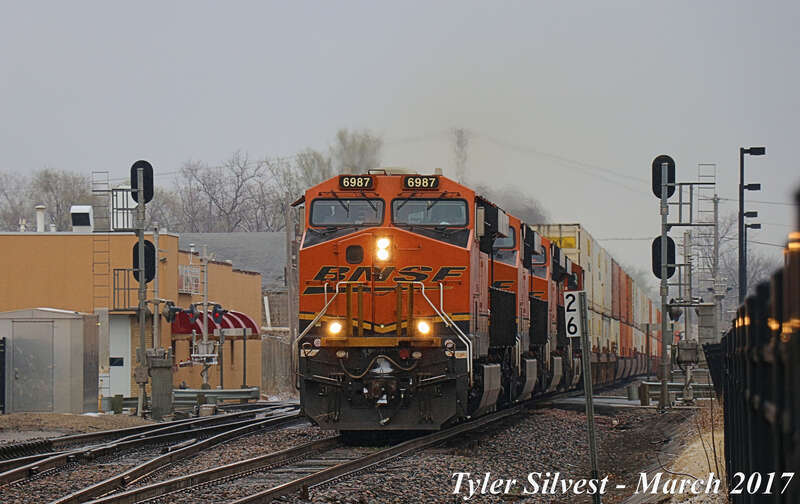 Burlington Northern Santa Fe 6987(ES44C4), 8177(ES44C4), 4287(ES44C4) and 7224(ES44DC) Lead a Westbound Intermodal on the BNSF Emporia Sub near Kansas Avenue and Loula Street in Olathe, Kansas
Photo Taken: 3-11-17 at 3:05 pm

Picture ID# 4360