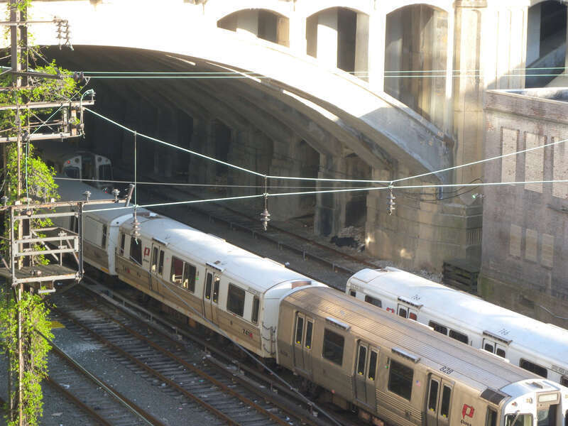 Looking southeast and down at piers holding up the arches of Hudson County Boulevard Bridge on a sunny late afternoon.  See File:Blvd Bridge west arch jeh.jpg for wide view from almost the same place.
