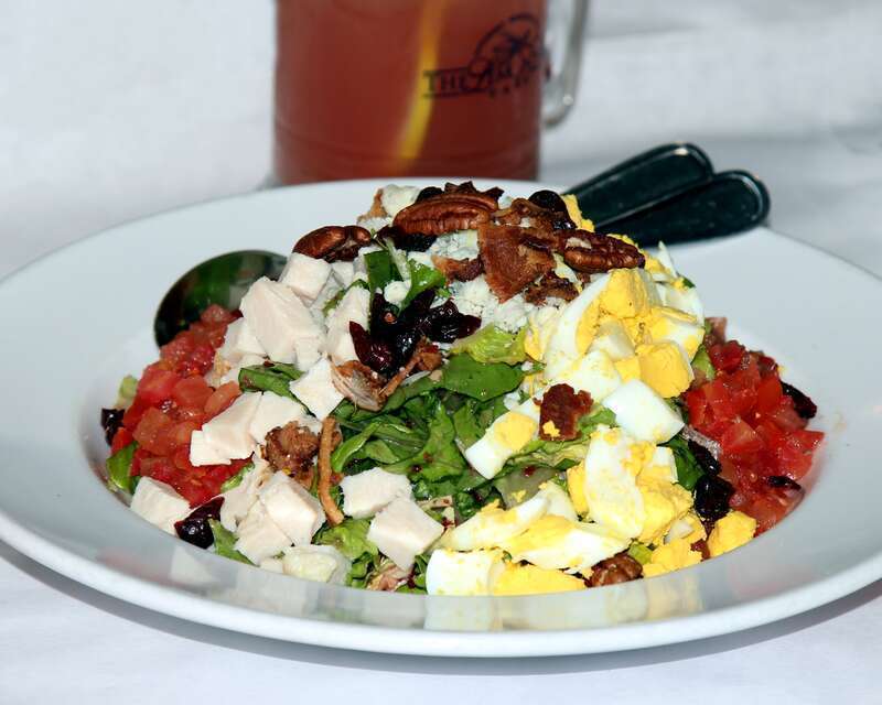 Lettuce greens tossed in our house cranberry poppy seed vinaigrette topped with rows of oven-roasted turkey breast, Gorgonzola cheese, egg, diced tomatoes, bacon, cranberries, and pecans
The LEMON LEAF Cafe
Historic Down Town Lancaster
653 W.