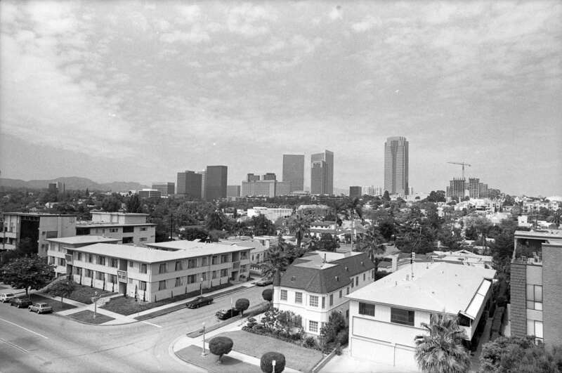 View of the Cheviot Hills neighborhood of Los Angeles facing northeast, with the skyscrapers of Century City in the background. The intersection at the lower left is S. Beverly Glen Blvd (foreground) and Keswick Ave. The house on Keswick immediately