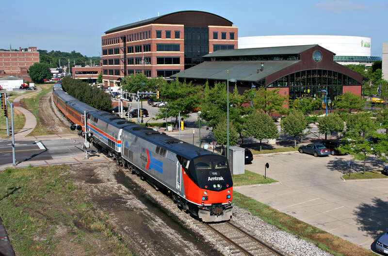 The "Chicago Express" with two Amtrak heritage units rolls by the John Deere Pavilion in Moline, Ill.  Ph 1 156 and Ph II 66 led the train from Rock Island to Chicago at the end of Train Festival 2011.