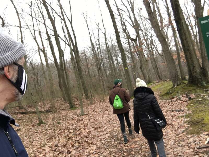 Due to the ongoing COVID-19 pandemic, masks are required during a First Day Hike on New Year's Day 2021 at Clay Pit Ponds State Park Preserve, Staten Island, New York.
