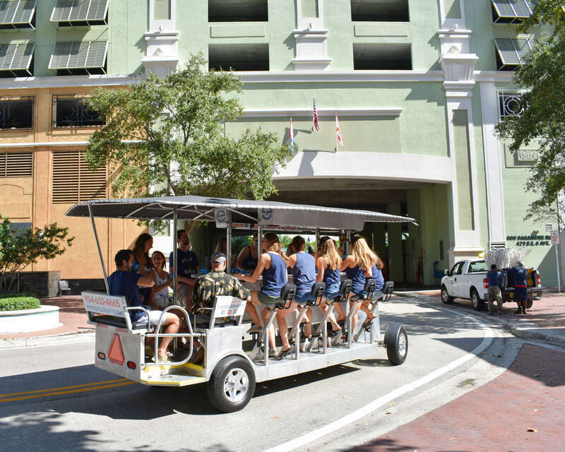 A Cycle Party conveyance nears the Riverside Hotel in Fort Lauderdale, Florida.