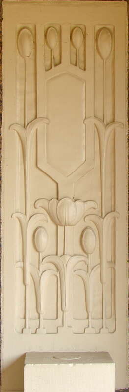 Carved stone inset into brick wall with tulip motif at Denkmann-Hauberg House on the NRHP since December 26, 1972. At 	1300 24th St., Rock Island, Illinois. Prairie School style home designed by Robert C. Spencer. Home to philanthropists John and