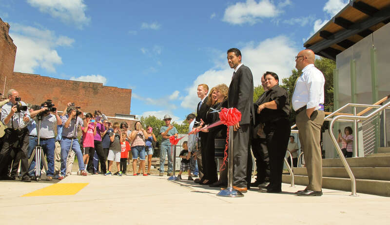 An image of the new Depot Square Railroad Station in Holyoke, Massachusetts on opening day. Dignitaries are gathered for the official ribbon cutting ceremony.