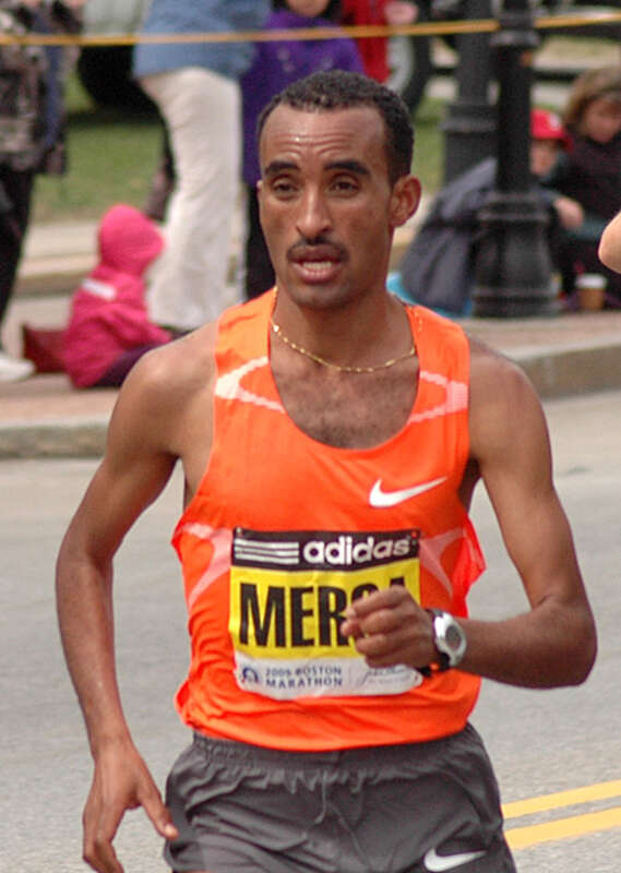 Deriba Merga winner of 2009 Boston Marathon near half way point in Wellesley Square