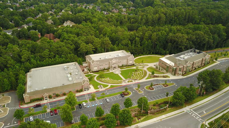 Aerial view of the East Campus including the Drummond Center (left), H Building (center) and Geier Hall (right). The South Campus is directly across the street.