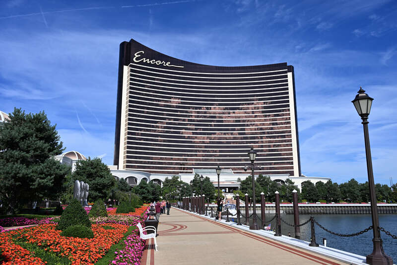 The Encore Boston Harbor building as seen from the riverwalk south of it.