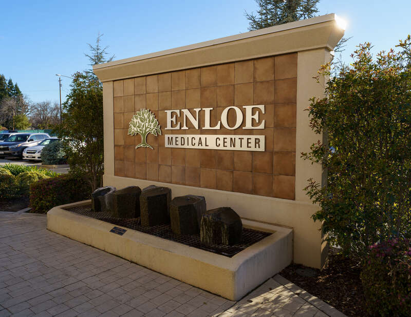 Signage at the entrance of Enloe Medical Center in Chico, California, on March 15, 2021.
