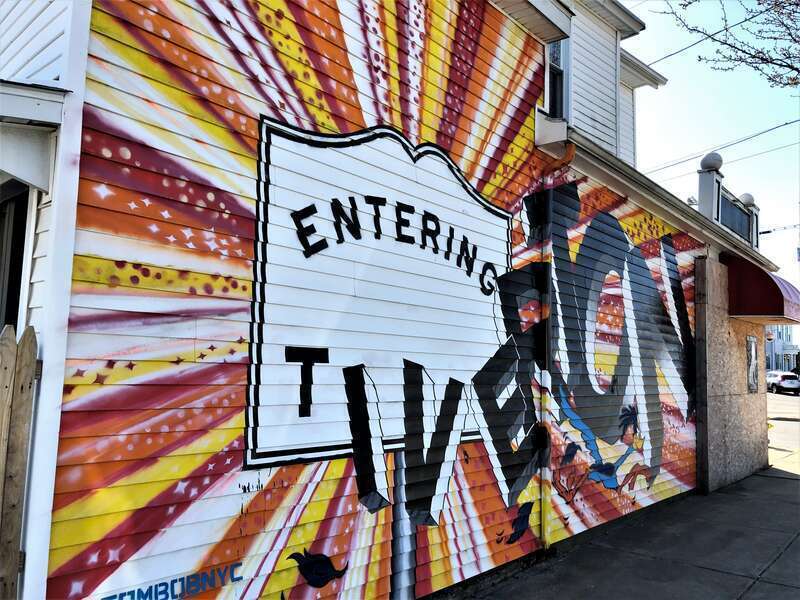 &quot;Entering Tiverton&quot; sign on the wall of 2A Main Road, Tiverton, Rhode Island.