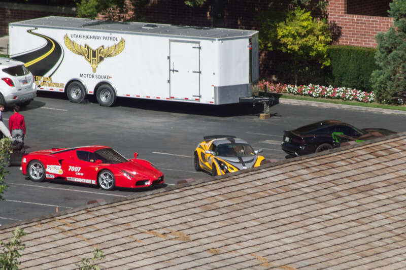 A Ferrari Enzo, a Lotus Elise and an SRT Viper GTS. The cars are participating in the 2015 Beehive Drive and are parked at The Little America Hotel in Salt Lake City. The picture was taken out of the Hilton DoubleTree hotel.