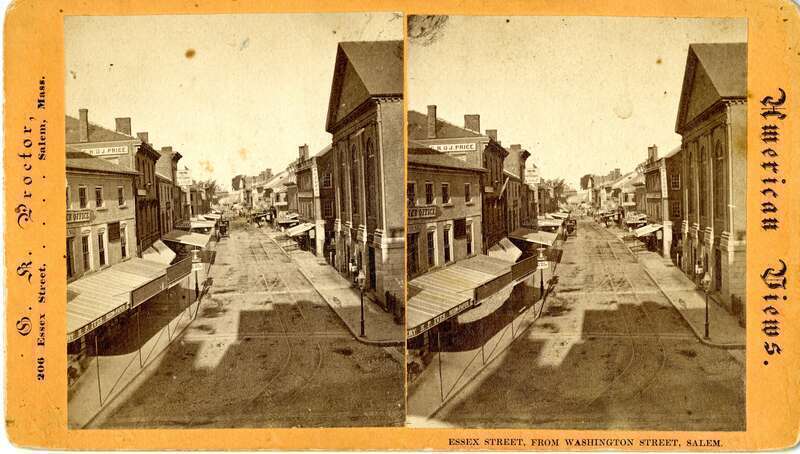 SV-060 — Nelson Dionne Collection. Aerial view looking down Essex Street, to the east, from Washington Street at Town House Square. The First Church building, before its c. 1874 renovation, is visible directly to the right.
Published by G.K. Proctor