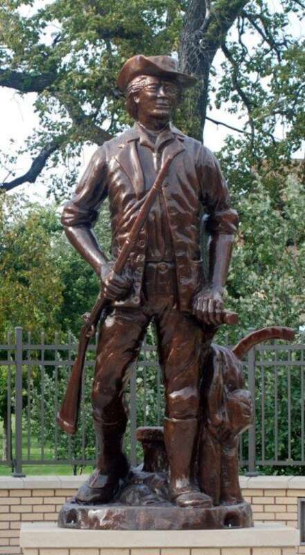 A statue of a &quot;Minuteman&quot; with a musket and plow, the symbol of the National Guard, stands guard at the entrance of the North Dakota National Guard headquarters at Fraine Barracks, Bismarck, N.D.
North Dakota National Guard Public Affairs
Date Taken: