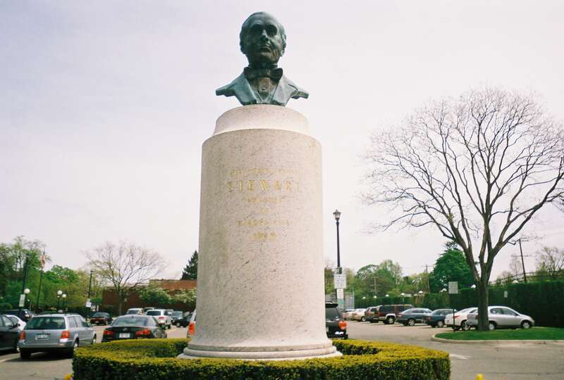 Bust of Alexander Turney Stewart, sculpted by Granville Carter, located in the north parking lot of the Garden City (LIRR station) in Garden City, New York.