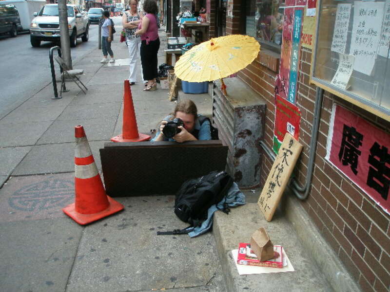 G Maxwell in a hole in the street, Chinatown Philadelphia