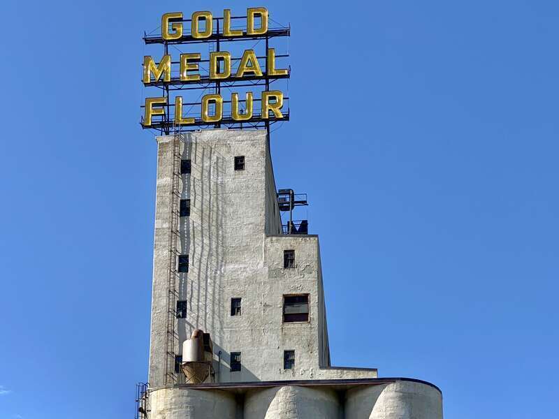Built in 1908 by the Haglin-Stahr Company, this 185-foot-tall concrete structure was added to the adjacent Washburn, Crosby and Company A Flour Mill to increase production.  The structure consists of 15 cylindrical concrete bins with a 5-story