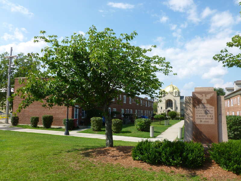 A memorial of the Greek-American Legion of Lowell, to brothers in arms.  Located at the intersection of Broadway Street and Dummer Street in Lowell, Massachusetts.