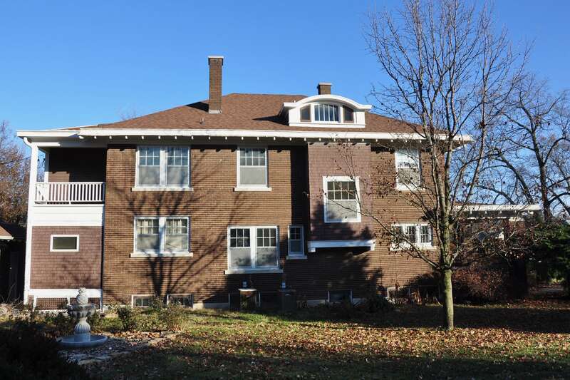 William and Augusta Guild House
The long west façade has four bays. There are seven 1-light basement windows.