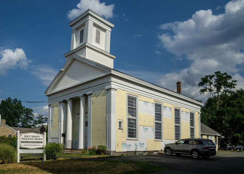 Holy Trinity Anglican Church, Plainville, Connecticut. Originally the First Baptist Church. &quot;The First Baptist Church in Plainville was organized in 1851. The Greek Revival church was erected in December of that year at 18 East Main Street on land