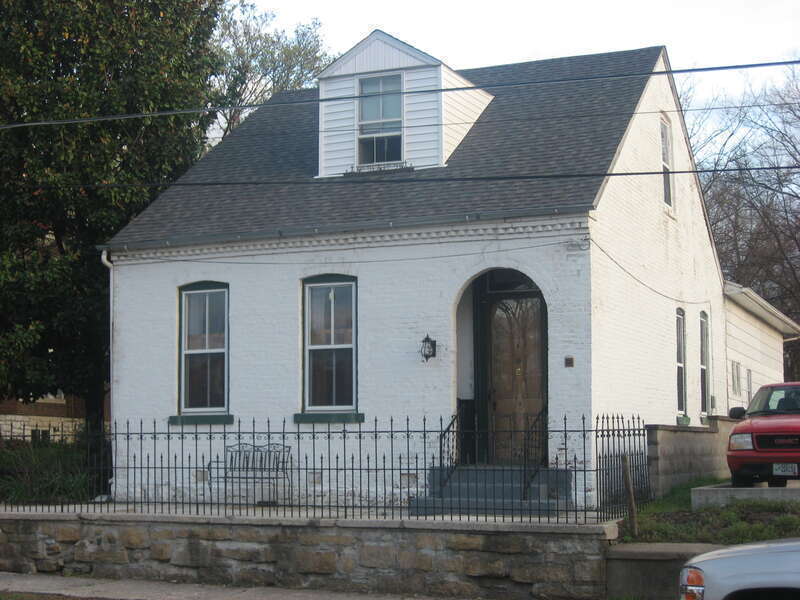 Front and western side of the House at 323 Themis Street in Cape Girardeau, Missouri, United States.  Built in 1864 in a vernacular German style, it is listed on the National Register of Historic Places, and it is part of a Register-listed historic