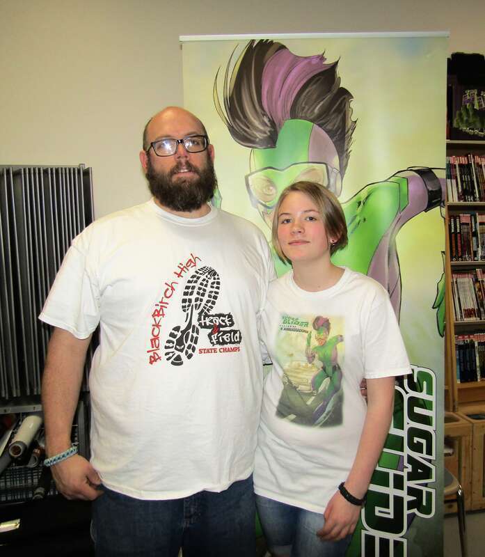 Jason and his daughter Shelbi Webb at a comic book signing event for their book Sugar Glider in the Dragons Keep in Provo, Utah.