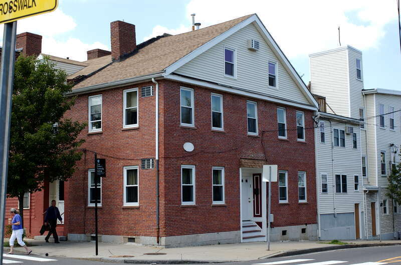 This red brick building is part of the Lechmere Point Corporation Houses, a site on the National Register of Historic Places. The entrance to 47 Gore Street is on the left and 25 3rd St is on the right.