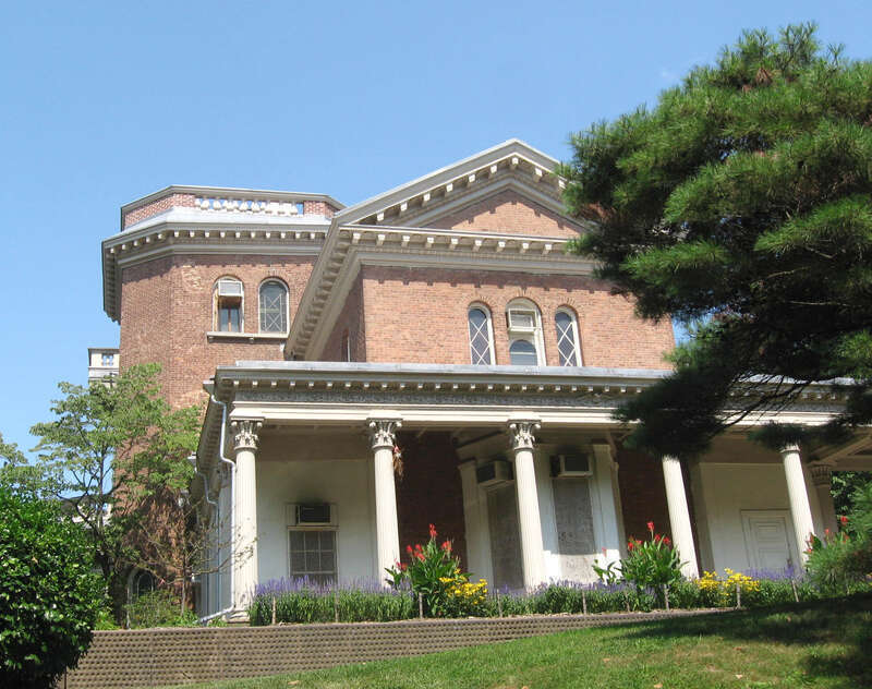 Looking up and north at Litchfield Villa on a sunny midday.
"On my way to a Wikipedia meeting."
See File:Corn-capital-litchfield.jpg for a detail.