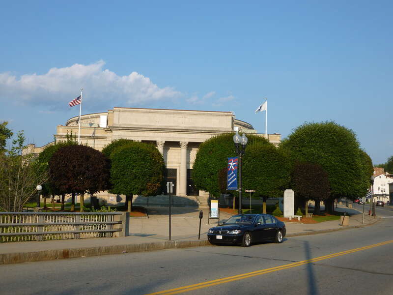 Lowell Memorial Auditorium, located at 50 East Merrimack Street, Lowell, Massachusetts.  Shown is the west (front) side of the building as viewed from the nearby bridge on East Merrimack Street.