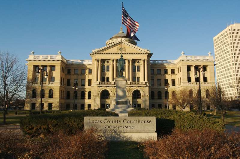 Lucas County Courthouse in Toledo, Ohio showing signage and statute of William McKinley.