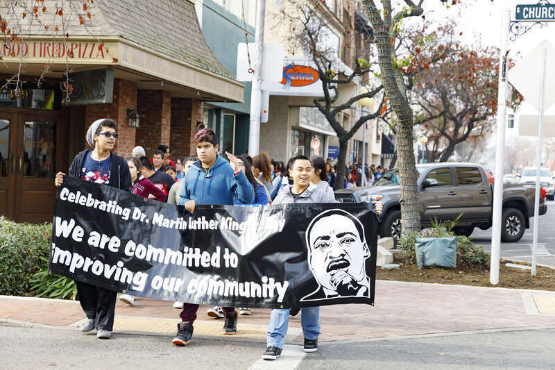 Holding Black sign – Joseph, Rico, Clarence