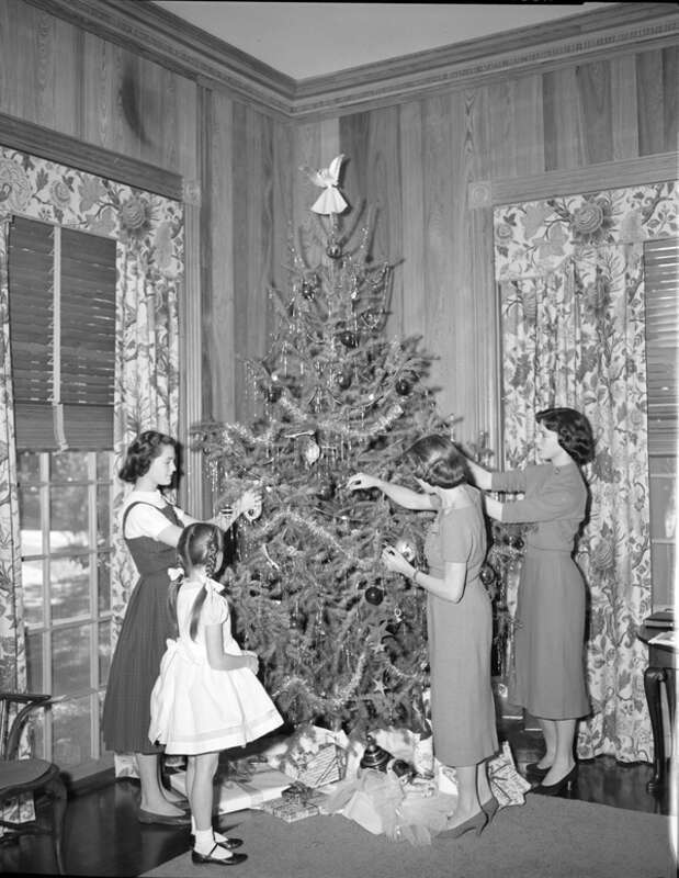 Persistent URL: floridamemory.com/items/show/261521
Local call number: TD00461B
Title: Mary Call Darby Collins and her daughters decorating a Christmas tree in Tallahassee, Florida
Date: December 21, 1957
Physical descrip: 1 photonegative - b&amp;amp;w -