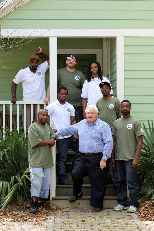North Charleston Mayor R. Keith Summey visits with the Sustainability Institute's Energy Conservation Corps at their Green House on East Montague.

Photo by Ryan Johnson