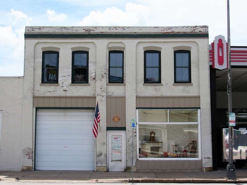 McCrellias Blacksmith Shop in the Davenport Motor Row and Industrial Historic District, Davenport, Iowa. It later housed Tri-City Carriage Works / Woeber Carriage Works and Schwieder Motor Co. It is now connected to the one-story building to the