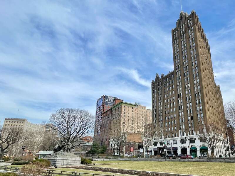 View of Military Park and the building skyline in Newark, New Jersey. Features sculpture Wars of America by Gutzon Borglum. The Military Park Building is the skyscraper on the right. Contributing properties of the Military Park Commons Historic