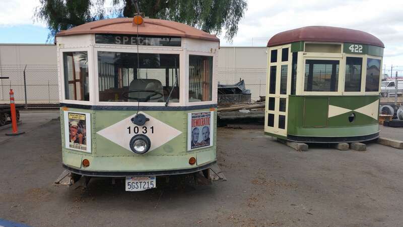 Two modified streetcars located just north of National City Depot, one has been modified into a van.
