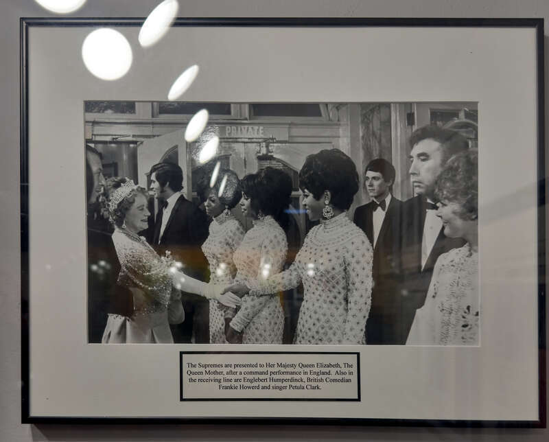The Supremes meet the Queen Mum.  Petula Clark is at the far right.