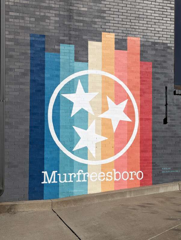 Rainbow mural in Murfreesboro, Tennessee featuring the Tennessee Tristar emblem